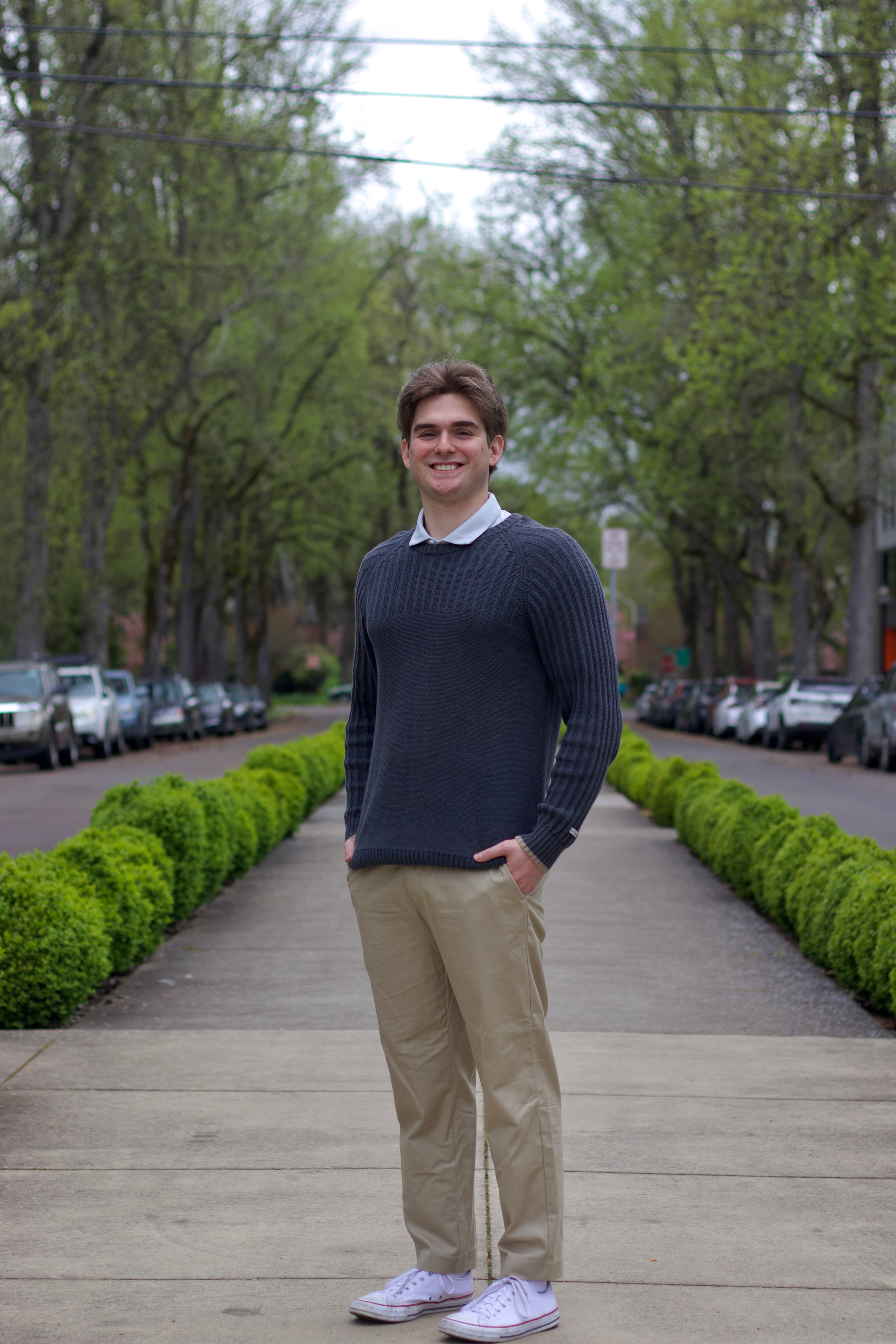 Camden Galen standing on a tree-lined street