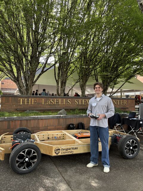 Camden Galen presenting the Woodpecker RC-controlled vehicle at the Engineering Expo
